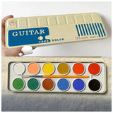 AOOKMIYA Japanese 12-color Opaque Solid Watercolor Paint Cake Pan with Built-in Brush Palette and Portable Watercolor Art Supplies